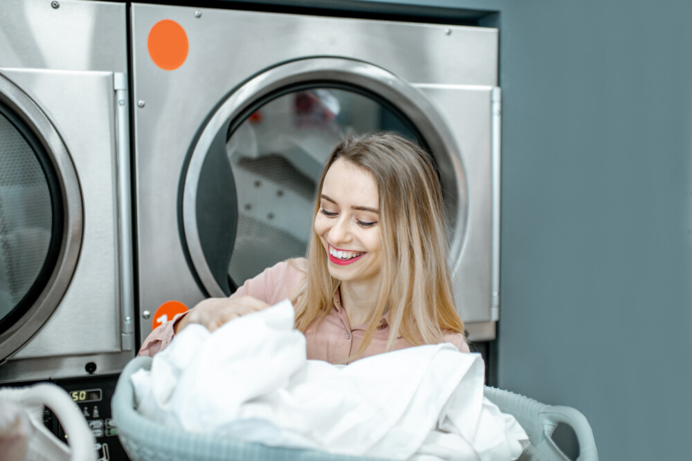 Happy woman in the laundry
