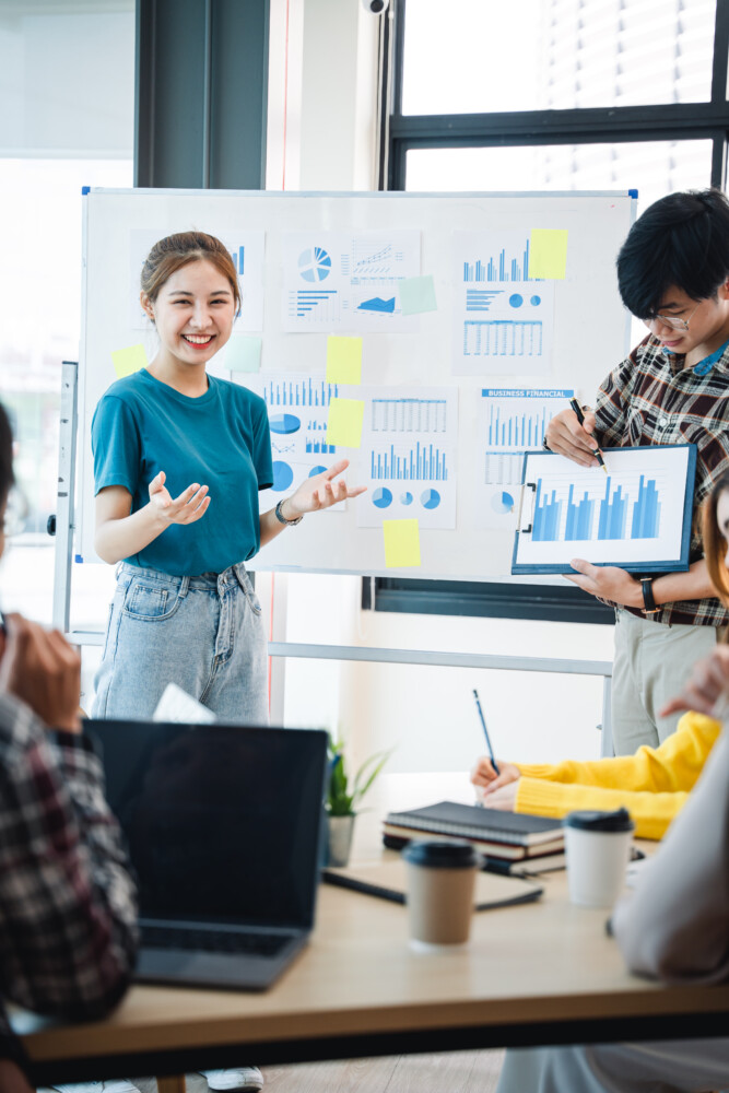 Successful business people present analytics reports while worki SEOlaundry