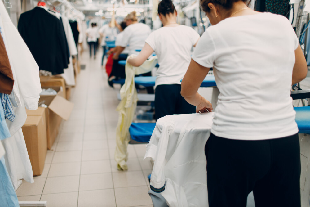 Dry cleaning clothes. Clean cloth chemical process. Laundry industrial dry-cleaning